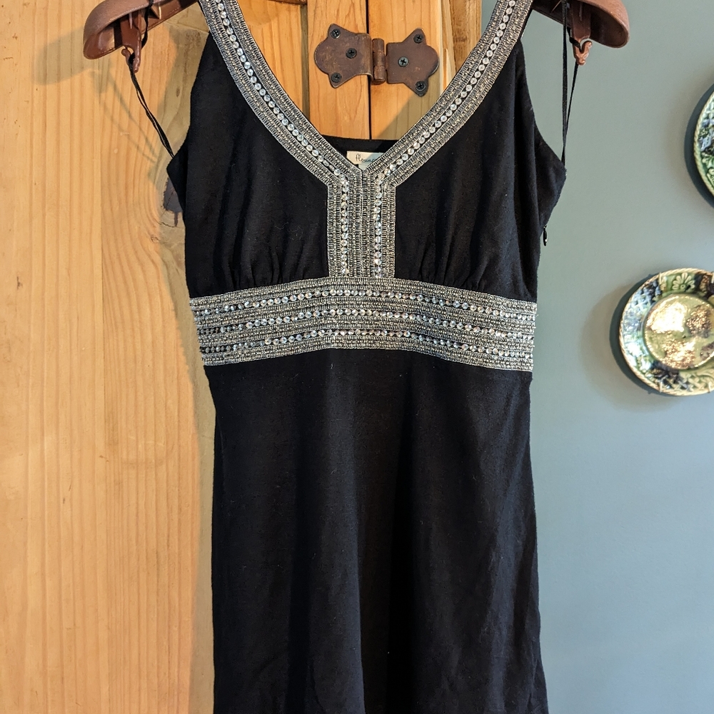 Flounce, trimmed sleeveless top